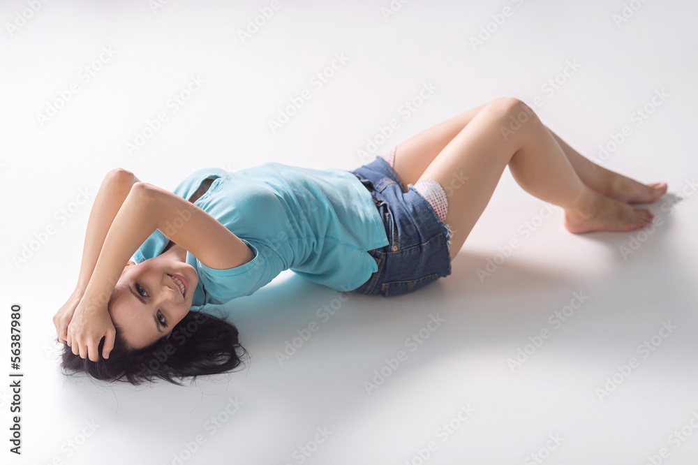 Obraz premium Beautiful woman. Top view of attractive young woman lying on the
