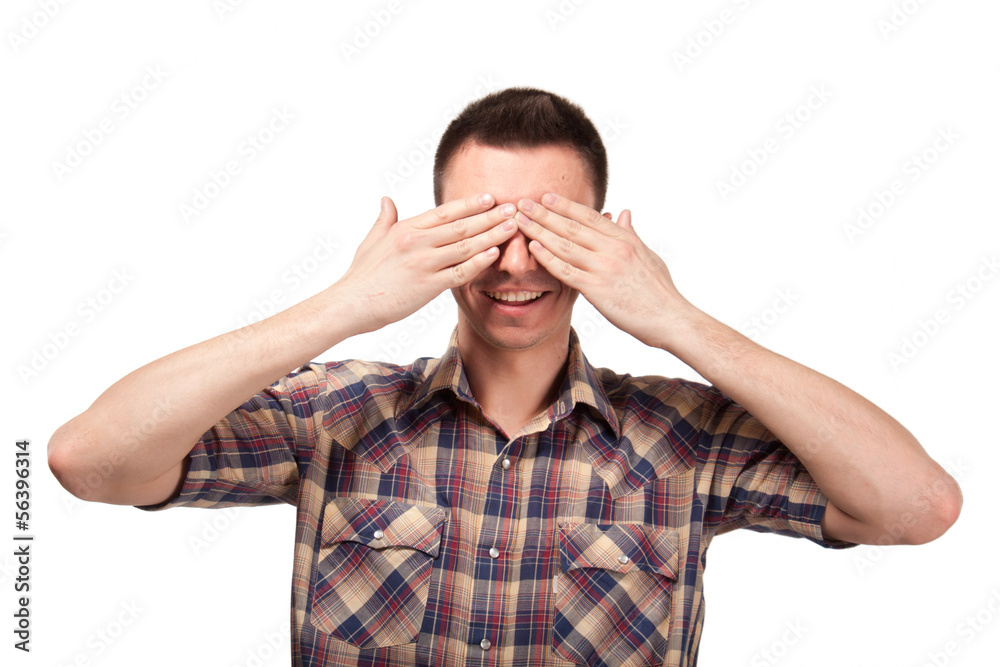 Man in plaid shirt covering his eyes Man in plaid shirt covering his eyes