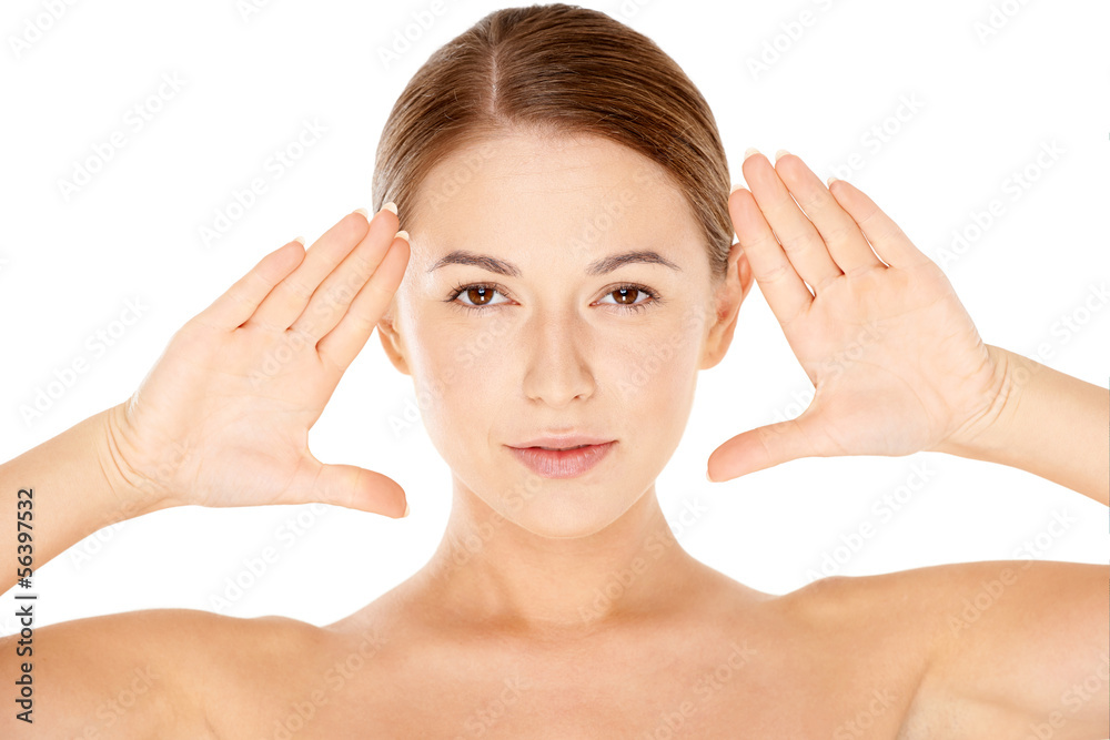 Beautiful woman framing her face with her hands Beautiful woman framing her face with her hands
