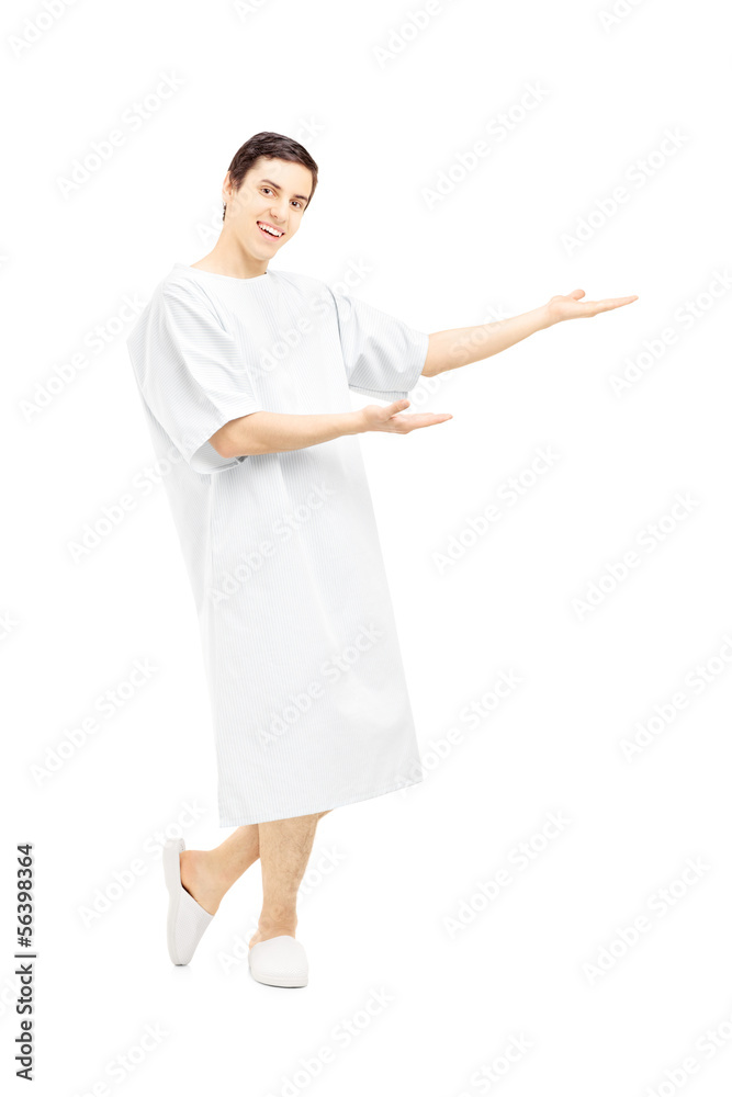 Male patient in a hospital gown gesturing with his hands Male patient in a hospital gown gesturing with his hands