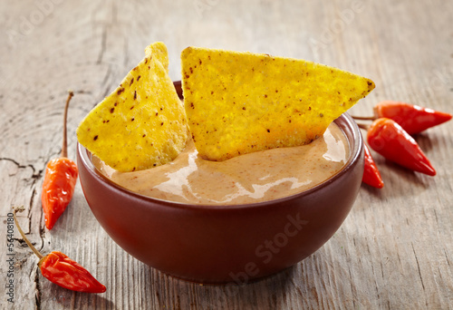 Bowl of dip and nachos