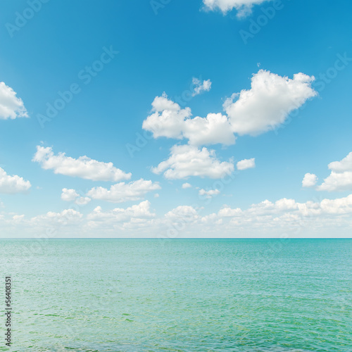 azure sea with blue cloudy sky