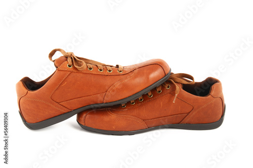 Brown leather men's shoes on white background.