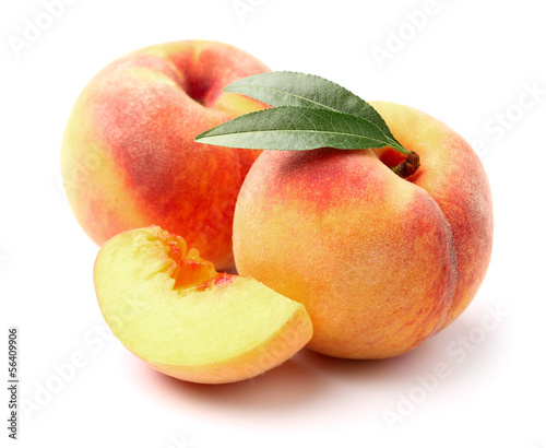 Ripe peaches with leaves