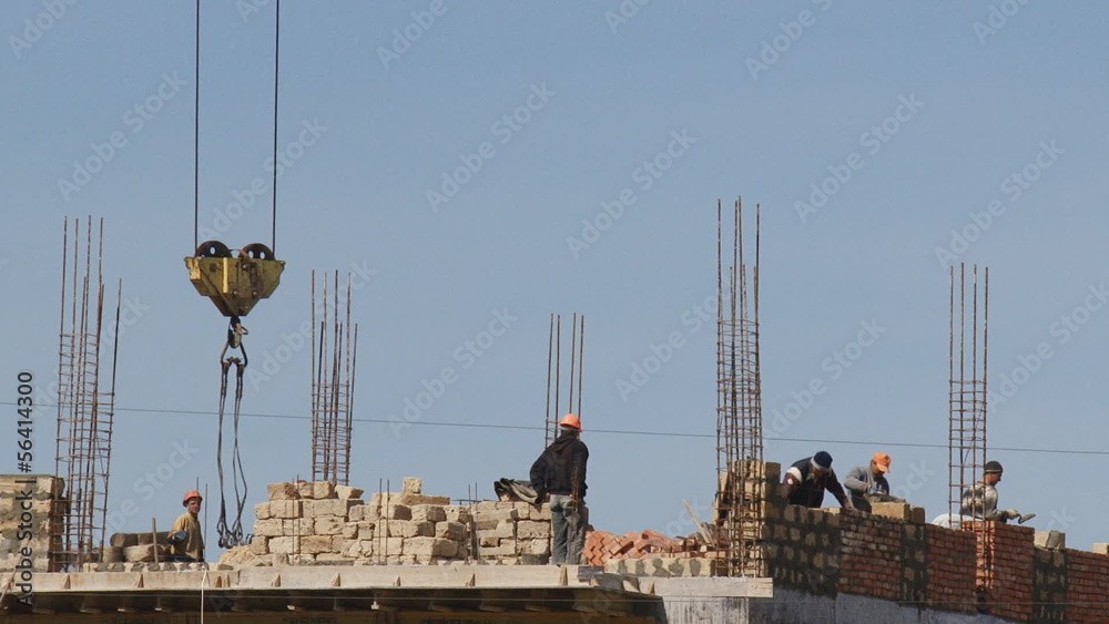 Bricklayers work on a construction site (timelapse)
