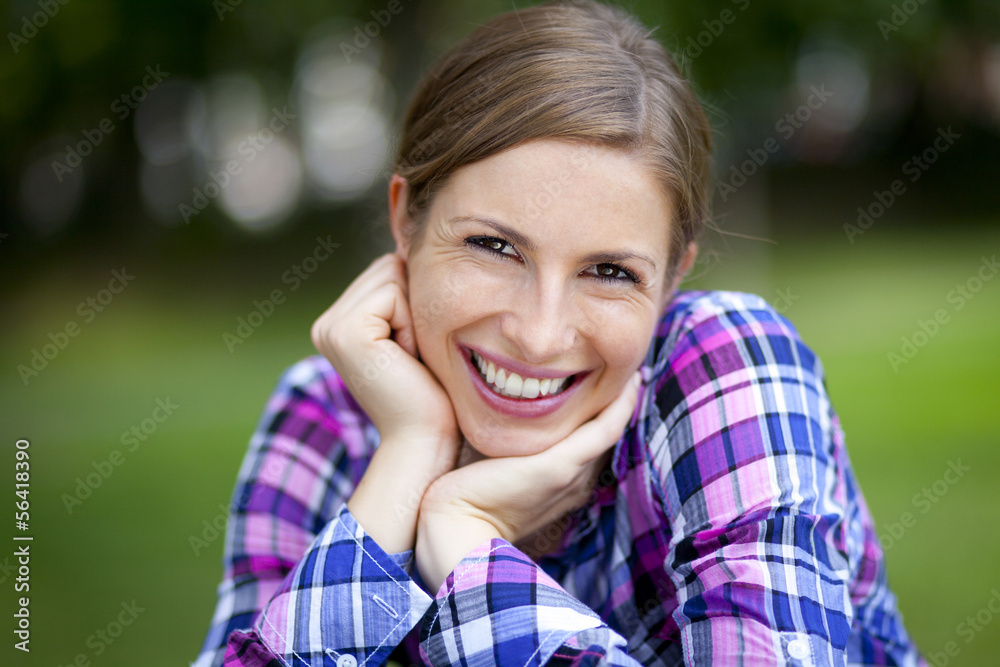 Serene Woman Smiling At The Park
