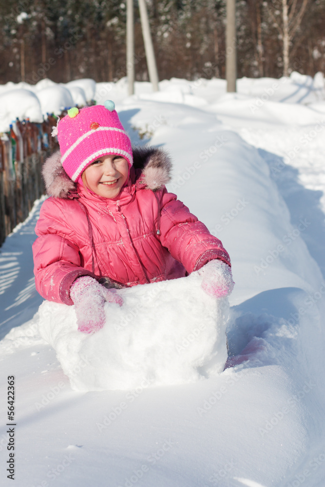 Beautiful happy kid in the red jacket