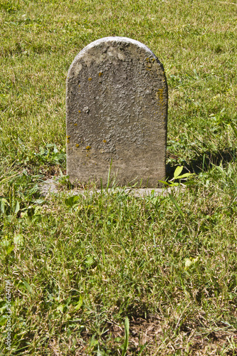 Small Unmarked Headstone in a Cemetery for a Child