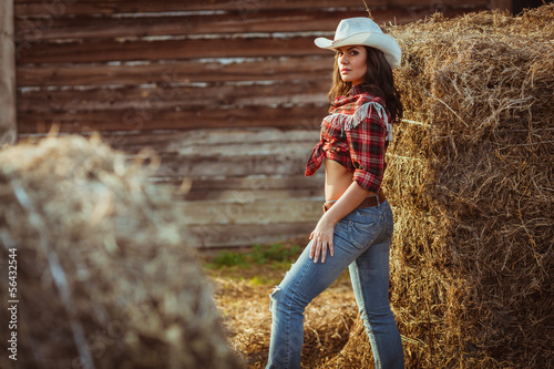young adult woman posing on farmland