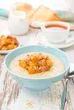 oatmeal with caramelized peaches, tea and yogurt for breakfast