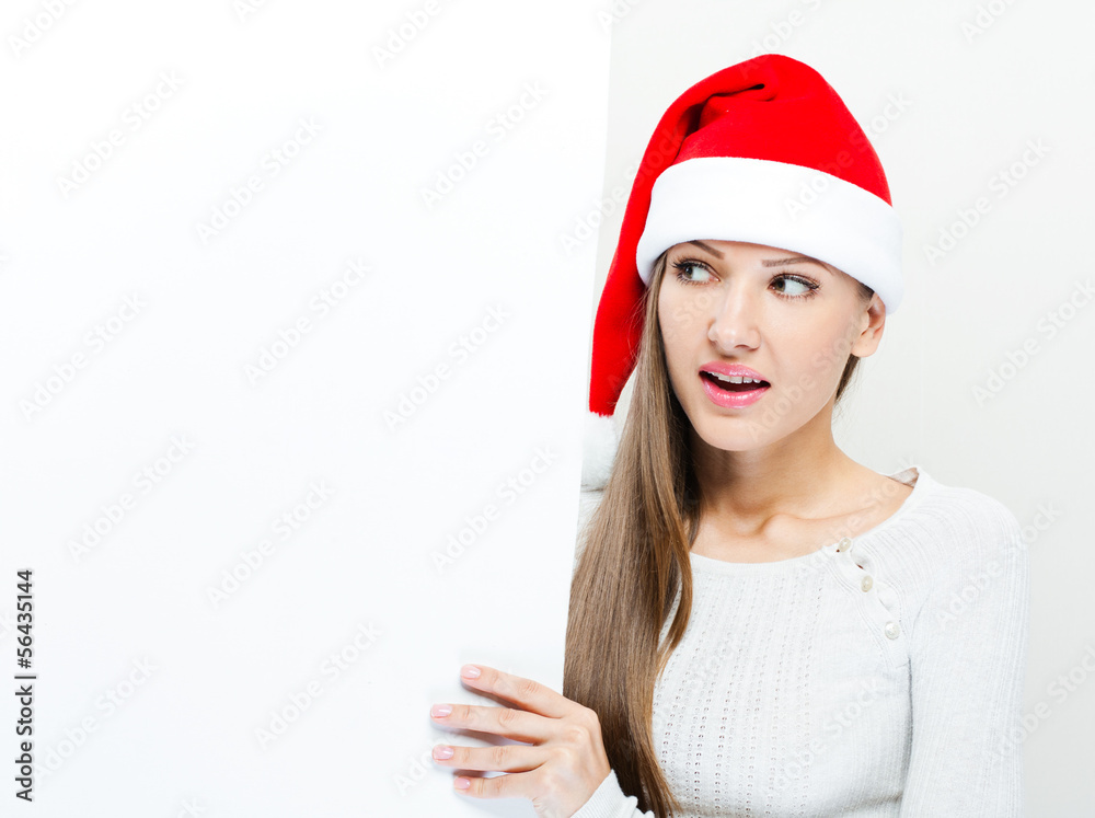 Christmas Santa hat woman portrait . Smiling happy girl . Showi Christmas Santa hat woman portrait . Smiling happy girl . Showi