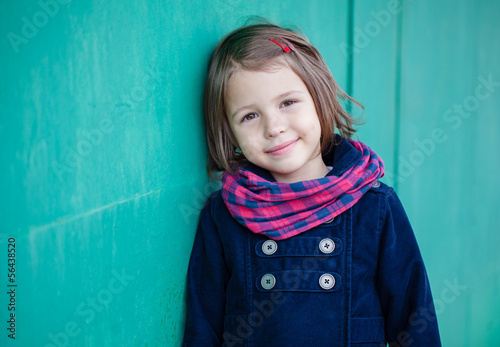 Photography Portrait of preschooler girl near green wall