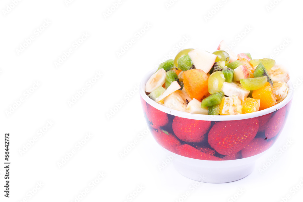 Plate of a tasty cuted fruits isolated on a white background.