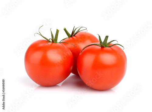 Three red deliciuos tomatoes isolated on white