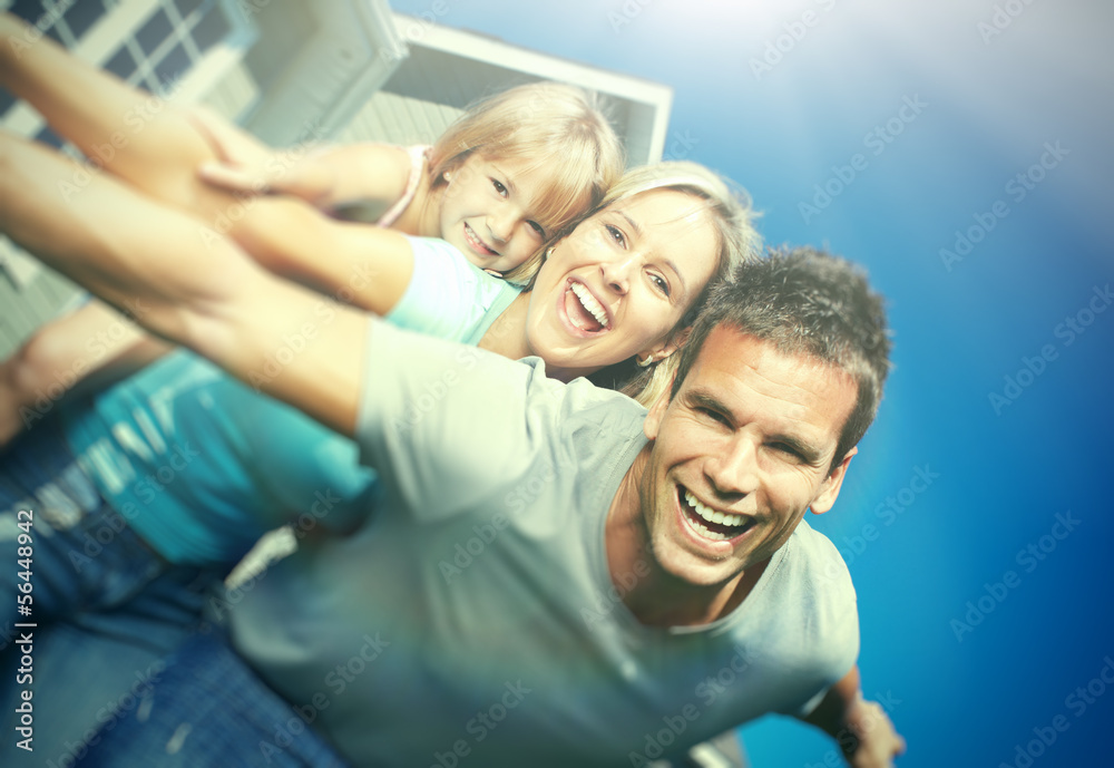 Fototapeta premium Happy family near the house