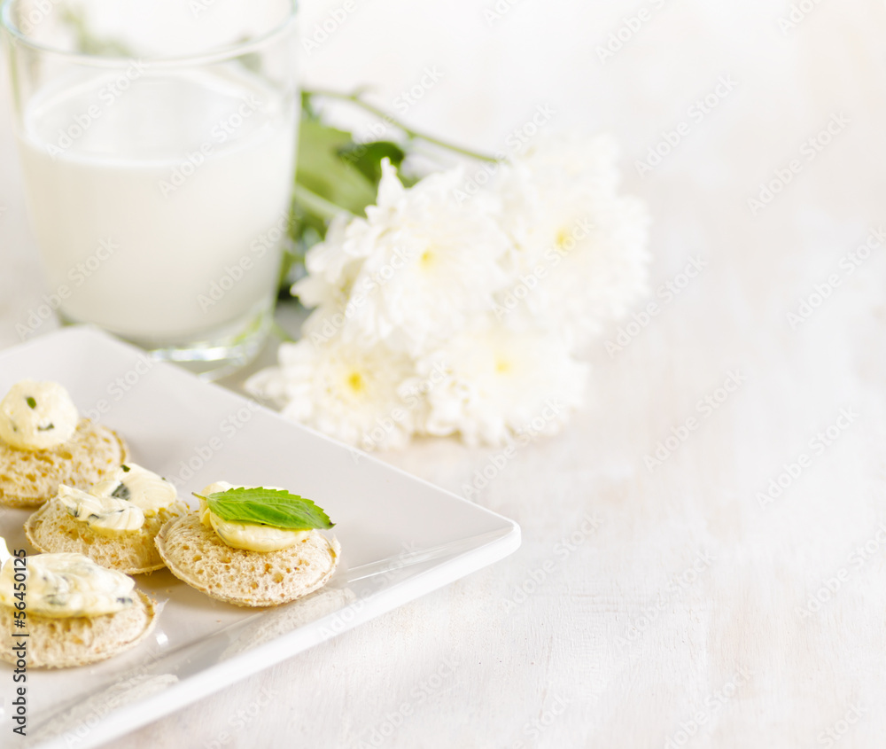 Several canapes and glass of milk Several canapes and glass of milk