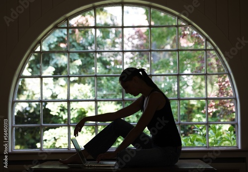 woman sitting with laptop photo