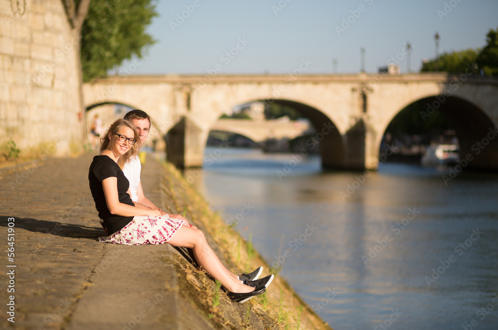 Beautiful couple on the Seine embankment