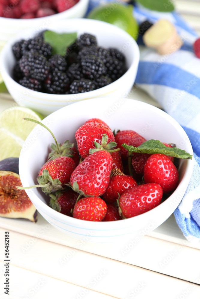 Assortment of juicy fruits and berries on wooden background Assortment of juicy fruits and berries on wooden background