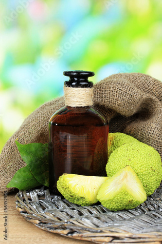 Osage Orange fruits (Maclura pomifera) and medicine bottle, photo