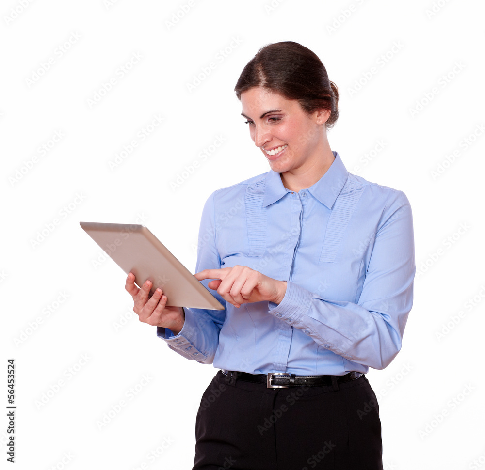 Attractive stylish female working on a tablet pc Attractive stylish female working on a tablet pc