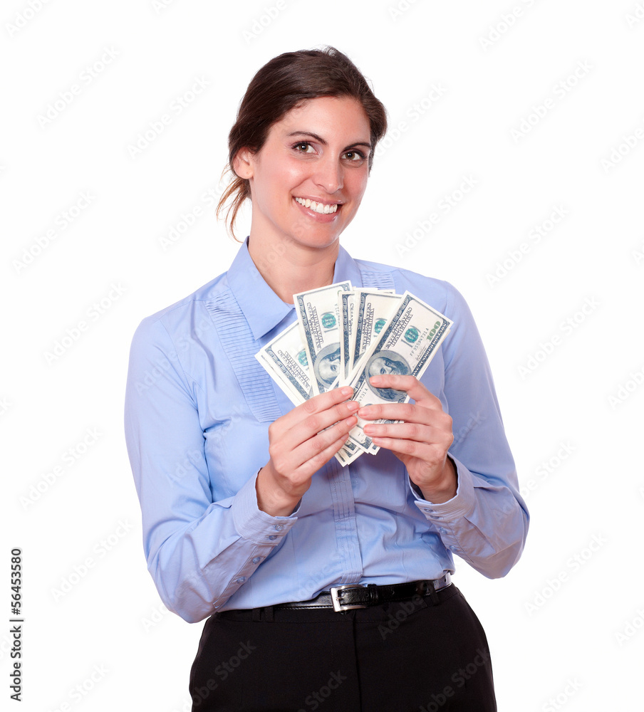 Pretty young woman smiling holding money Pretty young woman smiling holding money