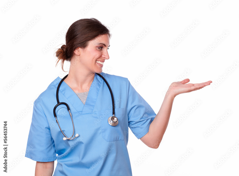 Pretty hispanic nurse standing with palms out Pretty hispanic nurse standing with palms out