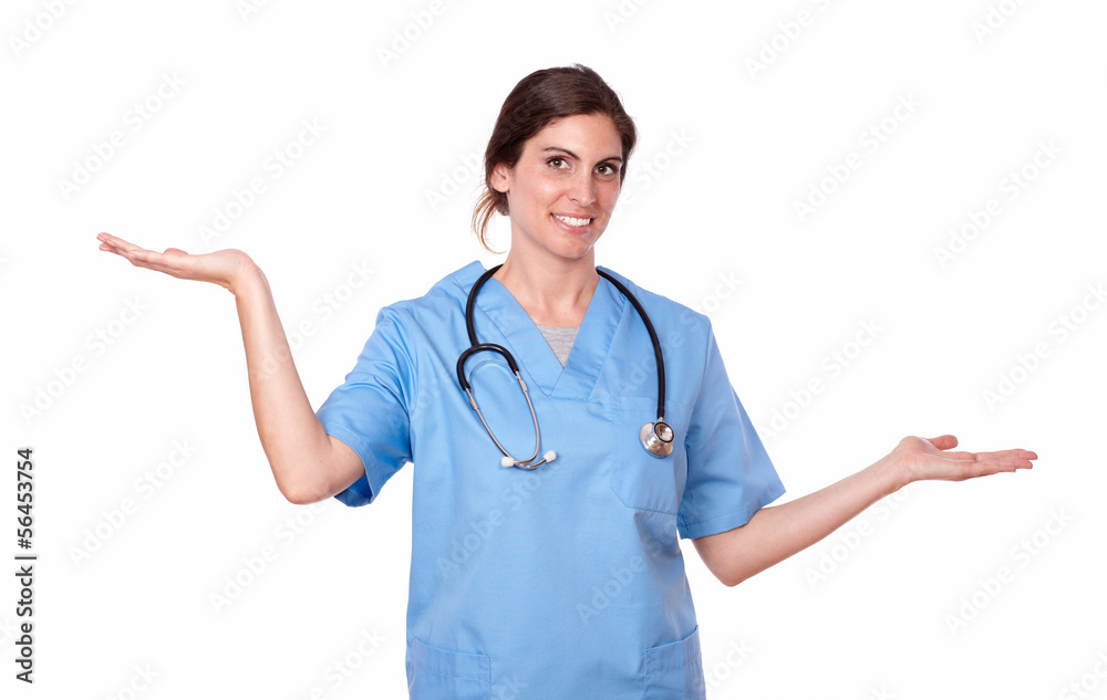 Pretty young nurse standing holding palms out Pretty young nurse standing holding palms out