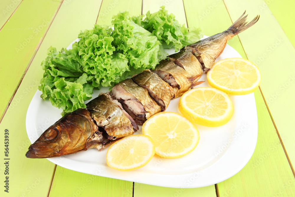 Smoked fish on plate close up