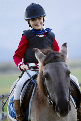 Horse riding, portrait of lovely equestrian on a horse © Gorilla