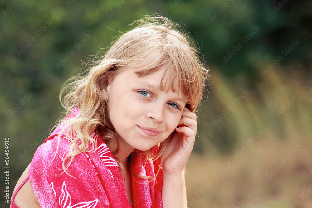 Little blond Caucasian girl in red shawl
