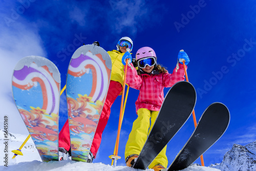Ski, snow, sun and fun - skiers enjoying winter