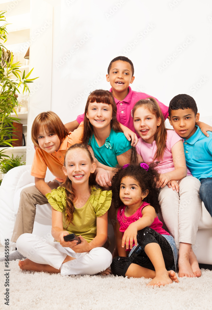 Group of kids with TV remote controll Group of kids with TV remote controll