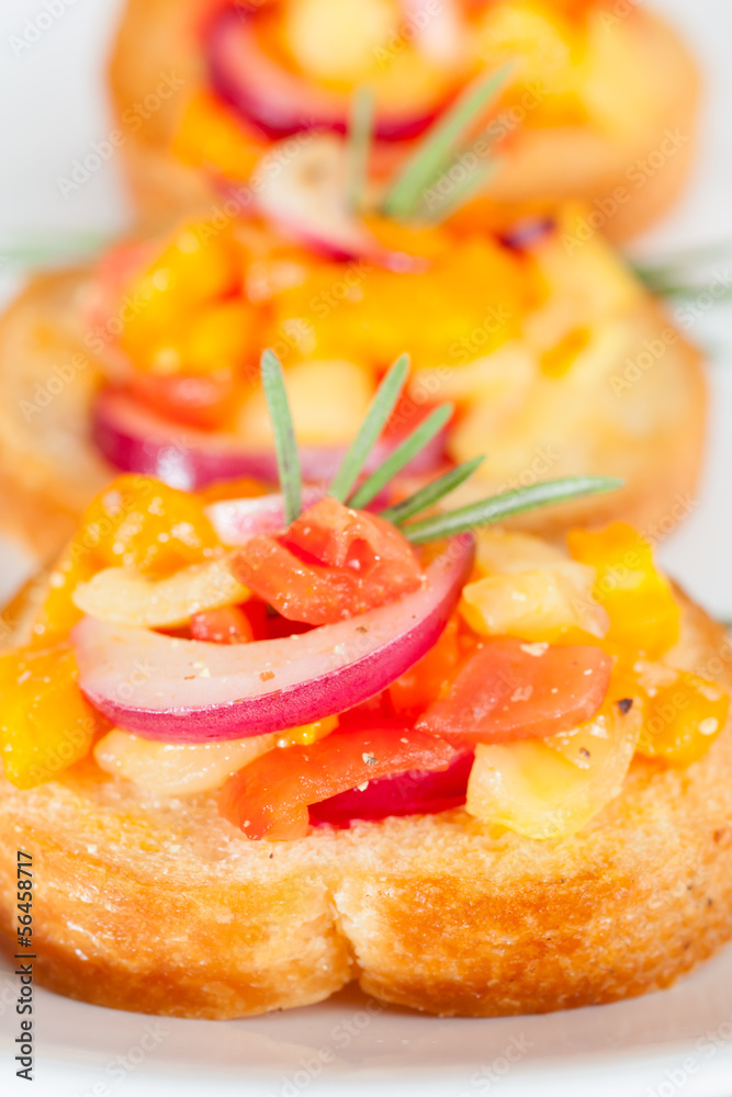 Bruschetta with fresh tomatoes and red onion Bruschetta with fresh tomatoes and red onion