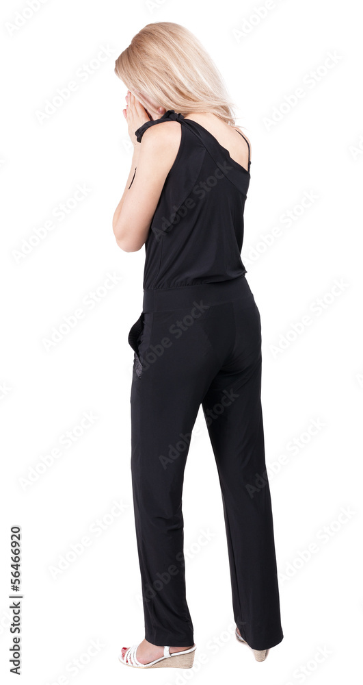 Back view of shocked woman. Back view of shocked woman.