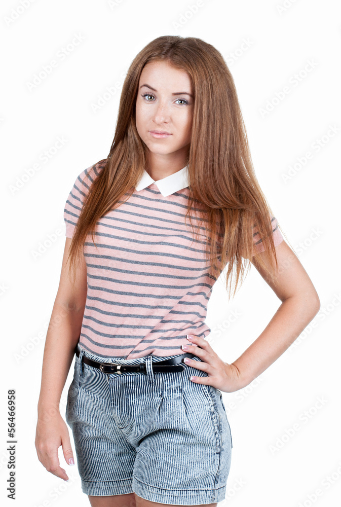 Fototapeta premium Red-haired teen girl in shorts.