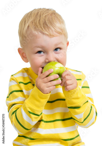 Kid boy eating green apple,...