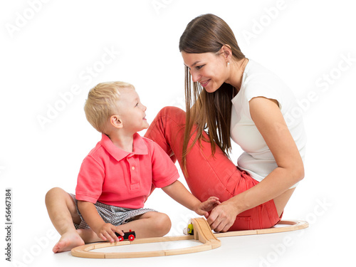 kid boy and his mom play wi...