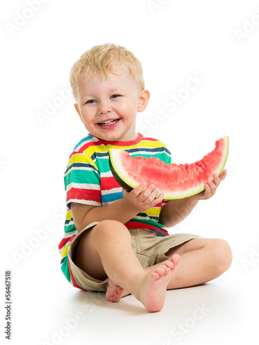 Child boy eating watermelon...