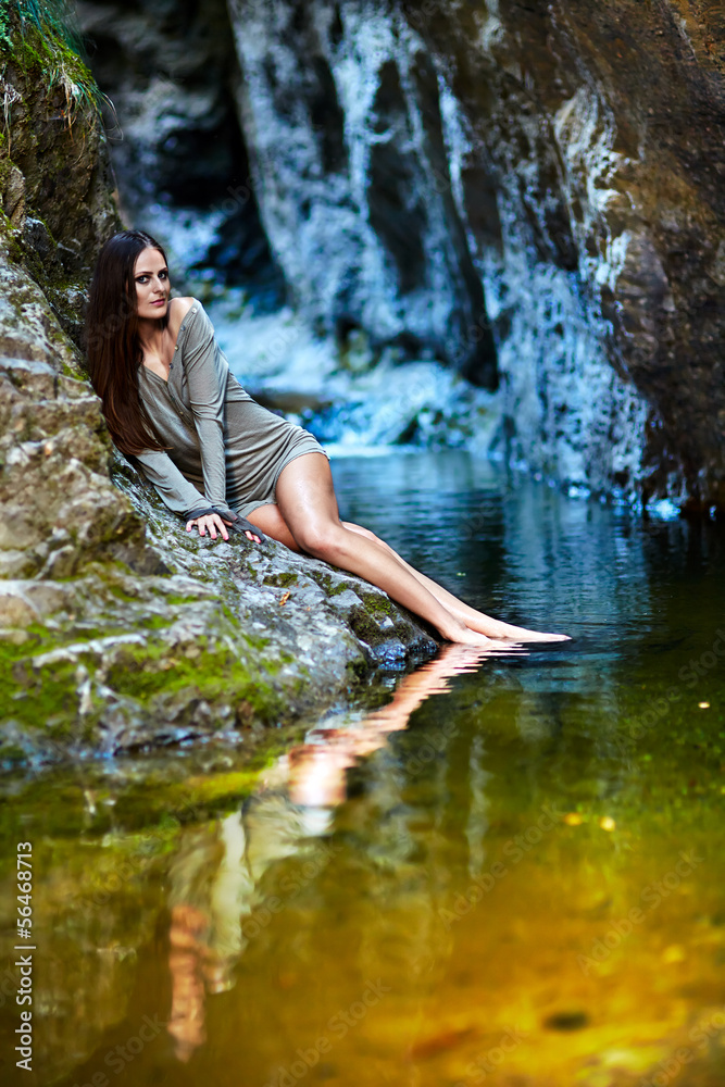 Sexy woman laying on the mountain rock Sexy woman laying on the mountain rock