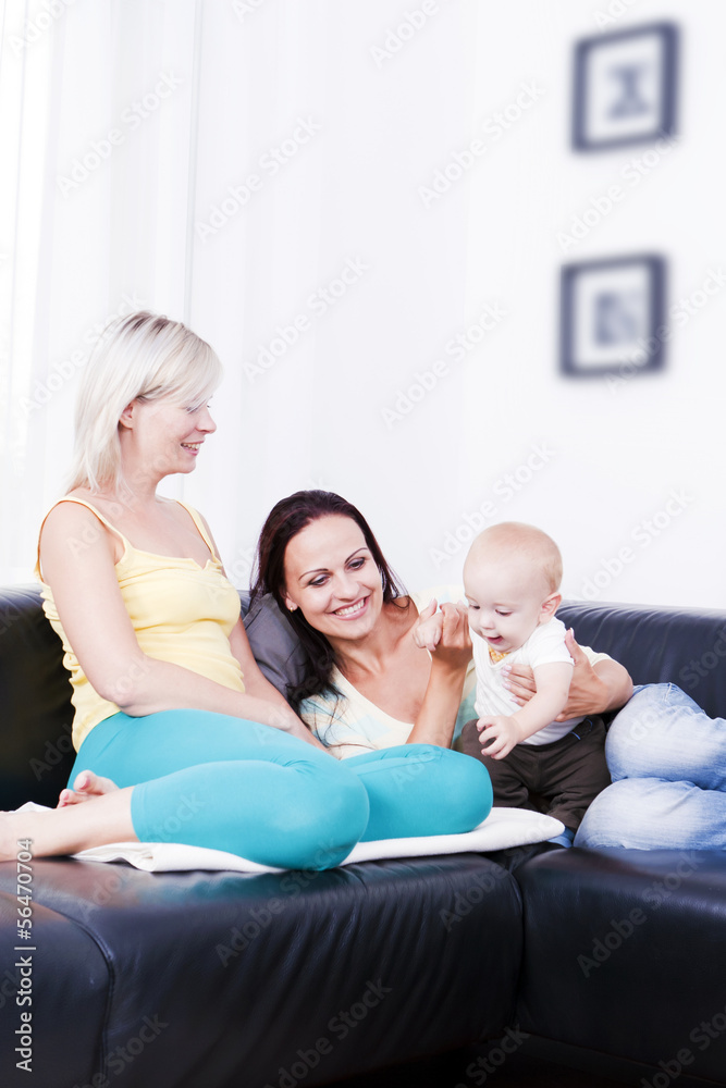 Family in living room with baby boy. Family in living room with baby boy.