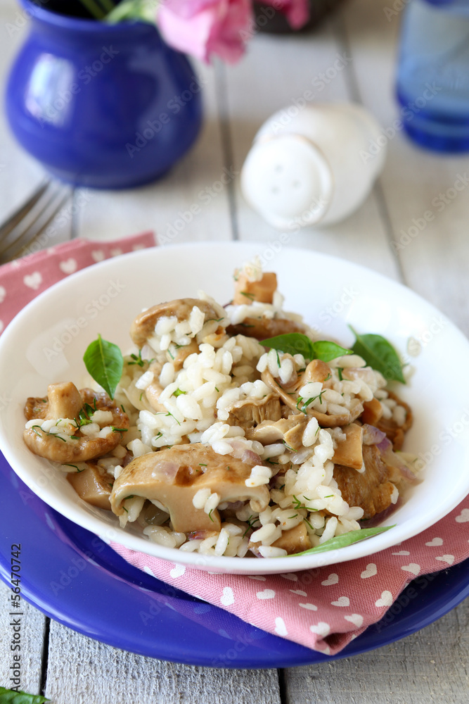 mushroom risotto in a white bowl