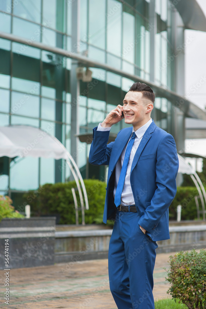 Portrait of a businessman talking on phone Portrait of a businessman talking on phone