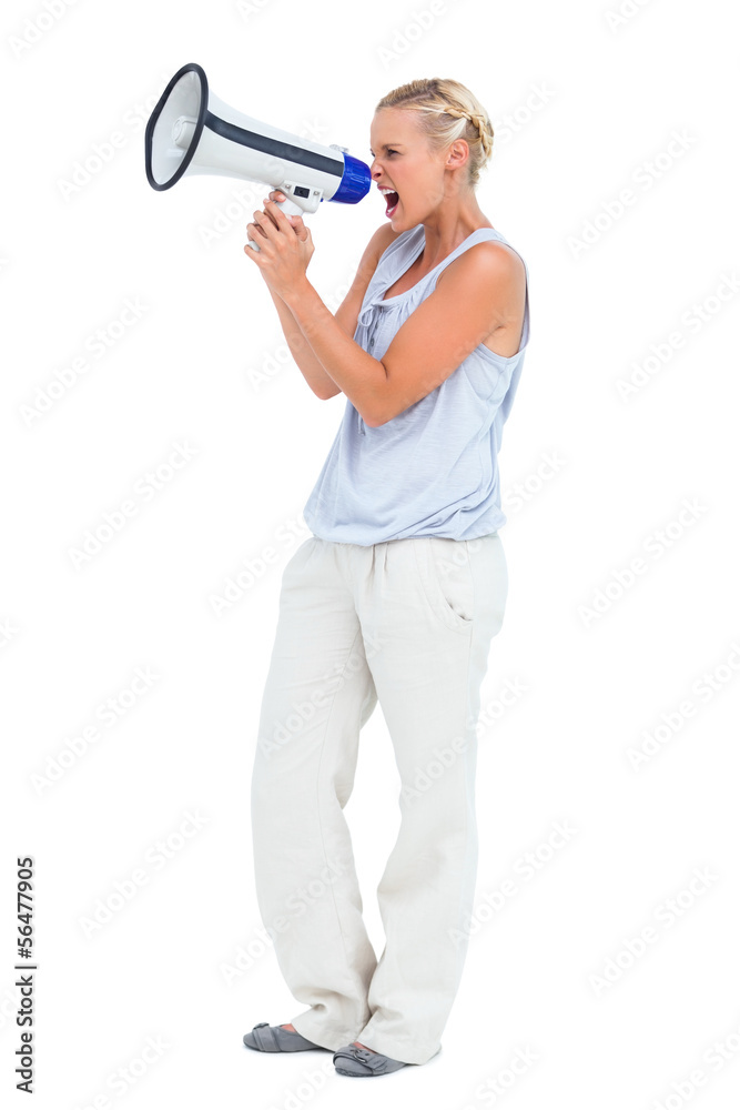 Naklejka premium Blonde screaming through megaphone