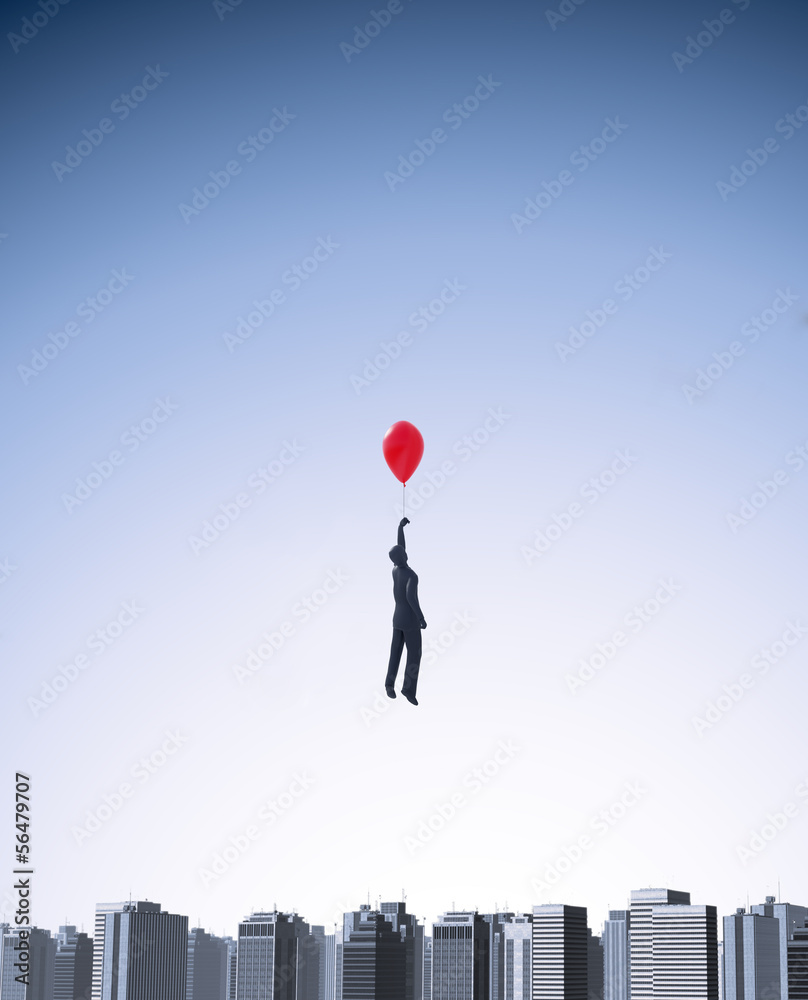 Balloon man floating above a city Balloon man floating above a city