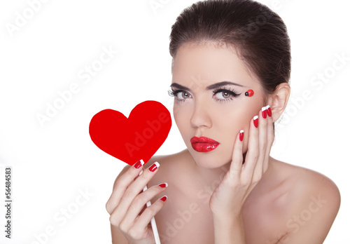 Beautiful woman with glamour bright makeup holding red heart iso