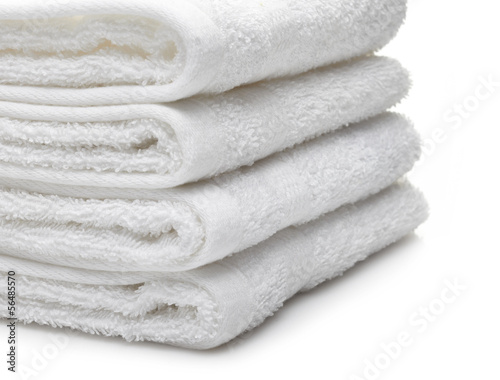 Stack of white hotel towels on a white background