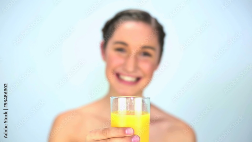 Happy young woman drinking orange juice Happy young woman drinking orange juice
