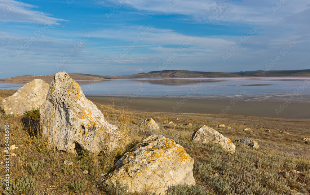 stones with salt sea on background