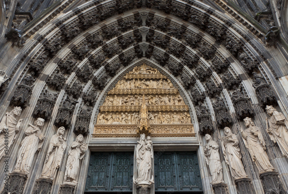 Details of stone figures on the facade of Cologne cathedral